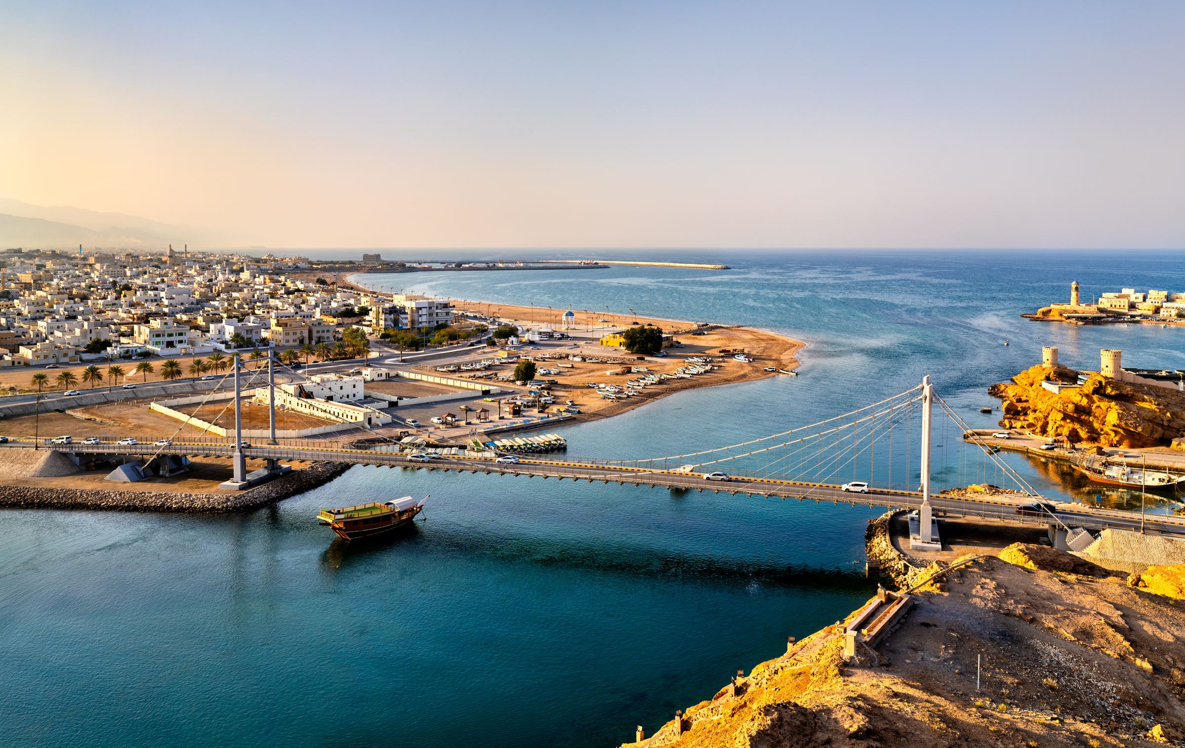 The Omani coast, with a bridge across the harbour