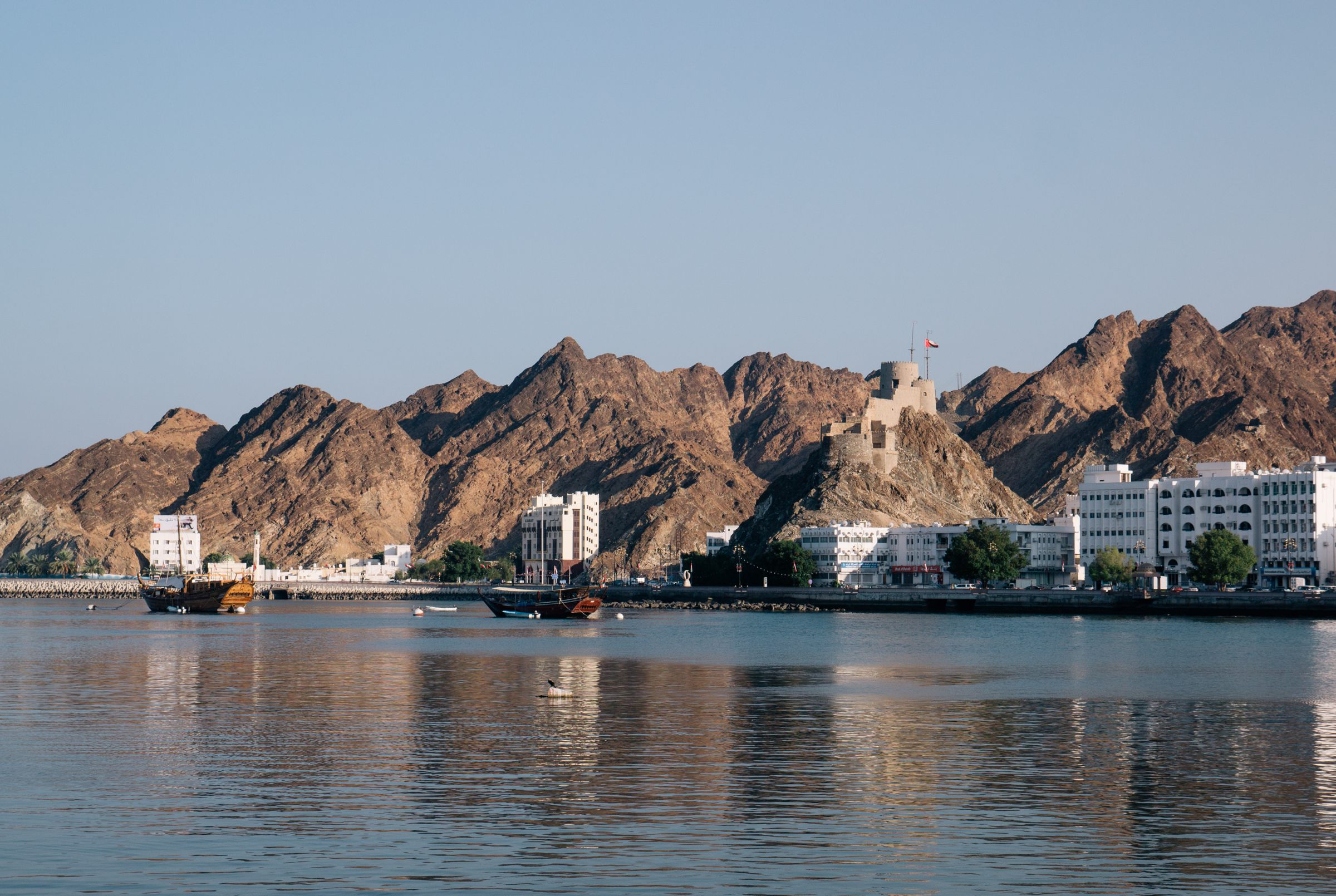 Muttrah Corniche in Muscat, with the Hajar mountains behind