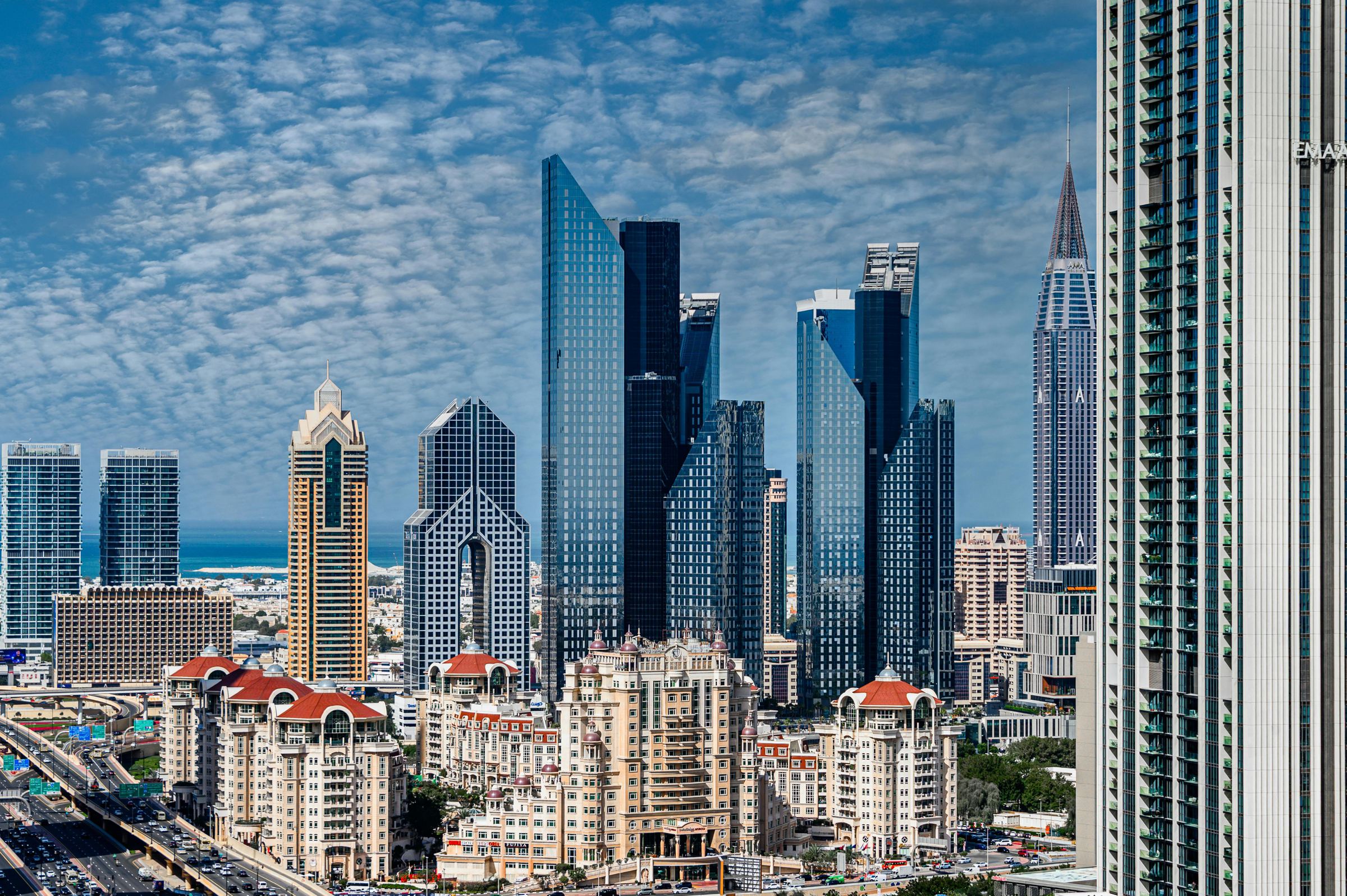 A city skyline of glass towers
